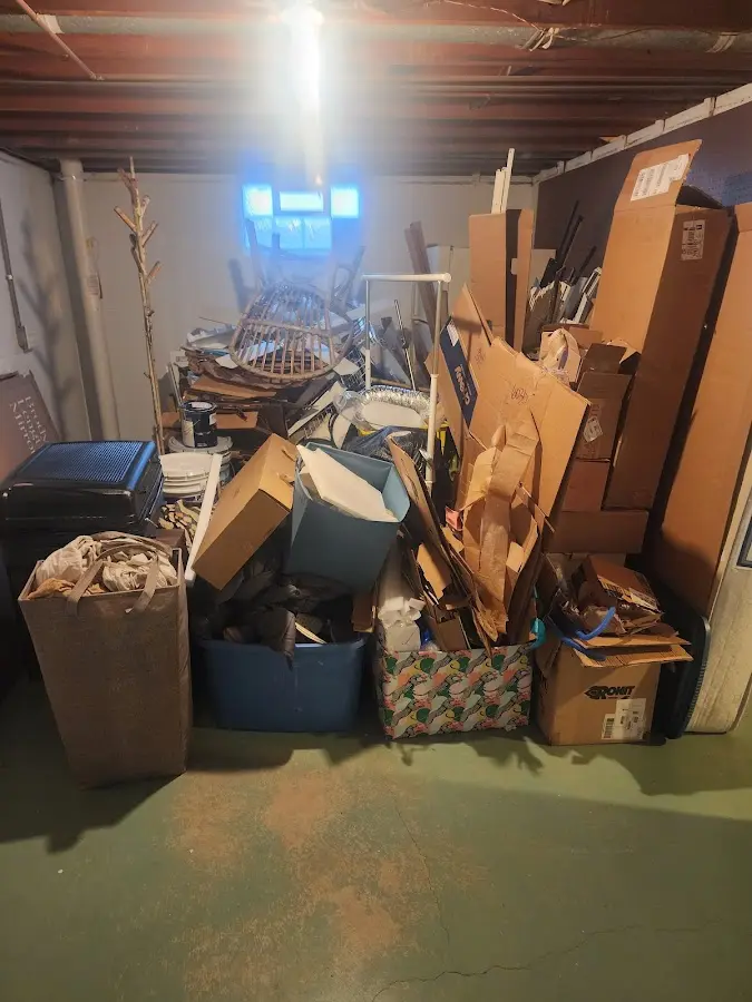 Roll-off dumpster container at job site for 2 Yard Dumpster Rental in Pineville