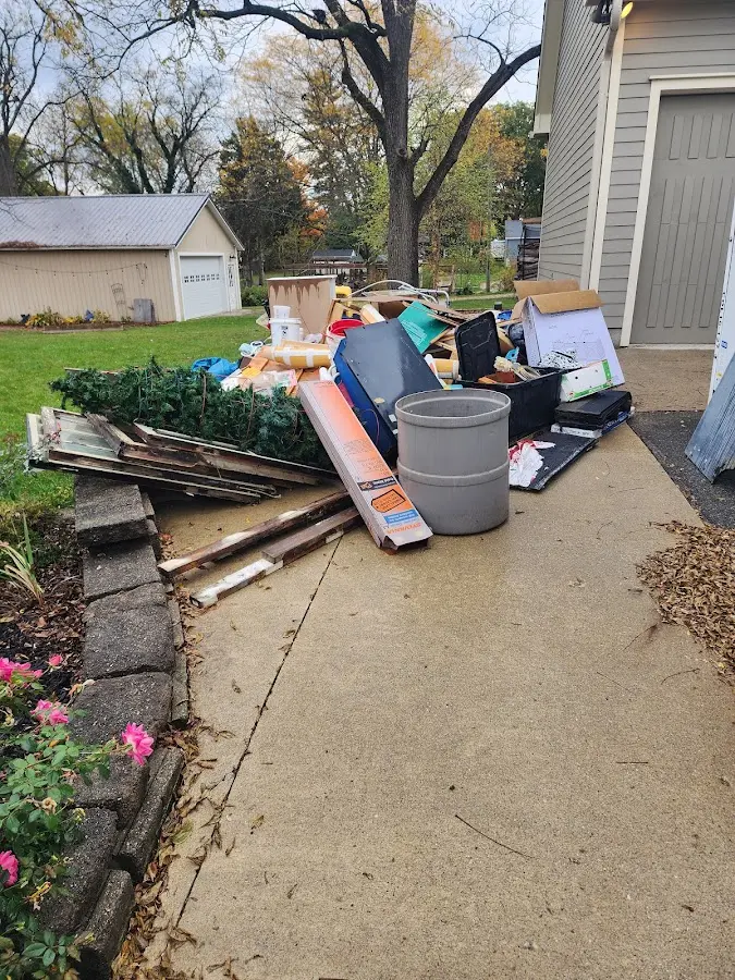 Dumpster being loaded with debris for 30 Yard Dumpster Rental in Pineville